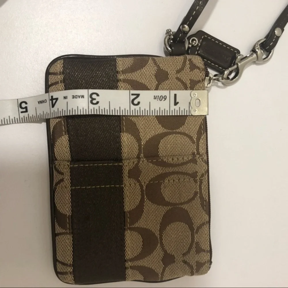Coach brown signature striker wristlet